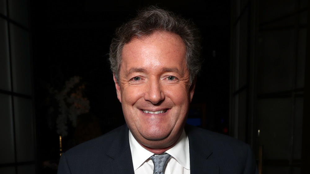 Piers Morgan posing for photo