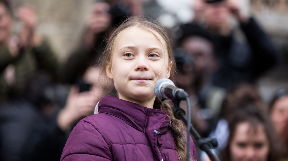 Greta Thunberg speaking to a crowd