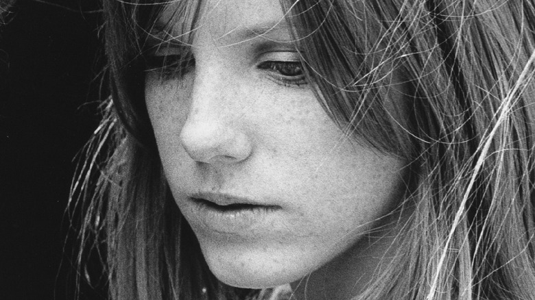 Pamela Courson looking down