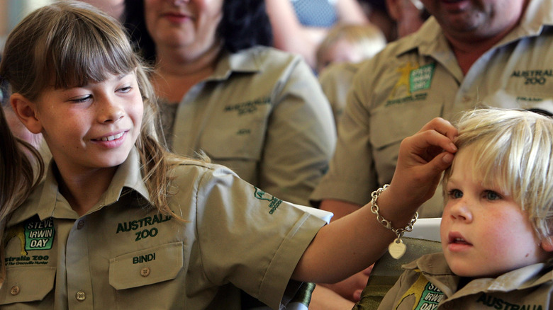 Bindi Irwin adjusts Robert Irwin's hair in 2008