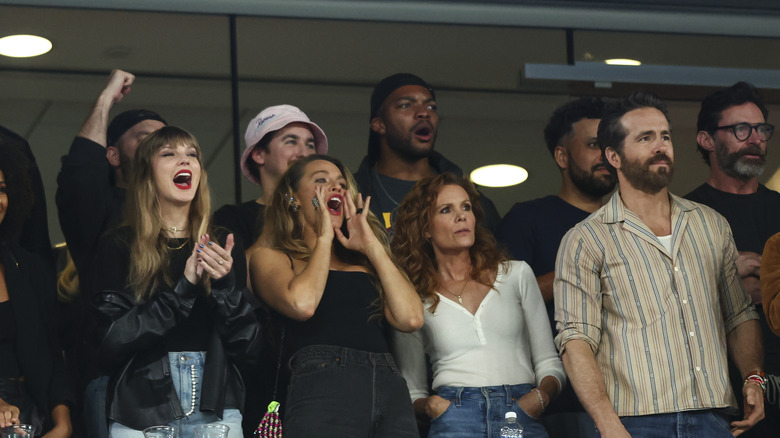 Taylor Swift and friends cheering at Chiefs game