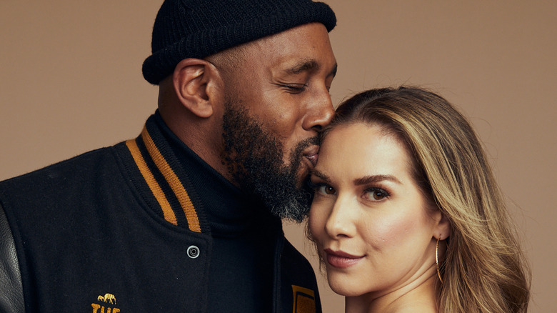 Stephen "tWitch" Boss kissing Allison Holker's forehead.