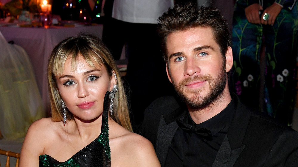 Miley Cyrus and Liam Hemsworth at an event