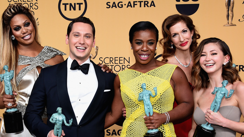 Laverne Cox, Matt McGorry, Uzo Aduba, Alysia Reiner, and Kimiko Glenn smiling at the SAG Awards