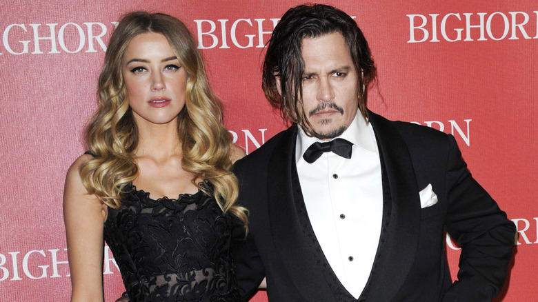 Amber Heard and Johnny Depp posing