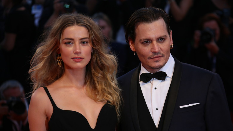 Amber Heard, Johnny Depp posing