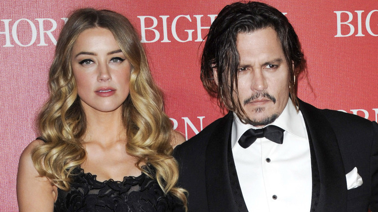 Amber Heard and Johnny Depp pose 