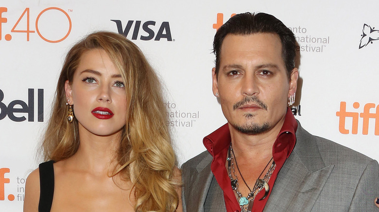 Amber Heard and Johnny Depp pose 