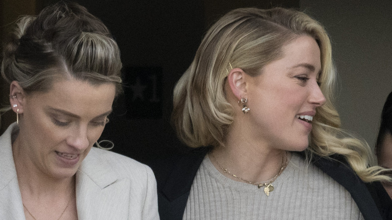 Whitney Henriquez and Amber Heard walking