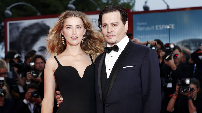 Amber Heard and Johnny Depp pose 