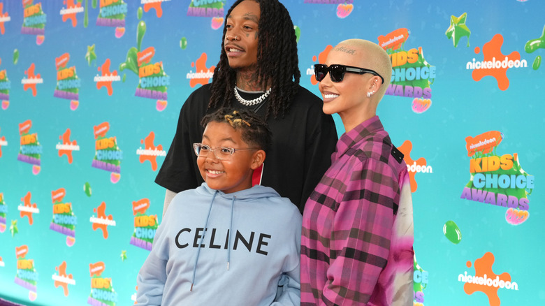 Amber Rose, Wiz Khalifa, and Sebastian posing