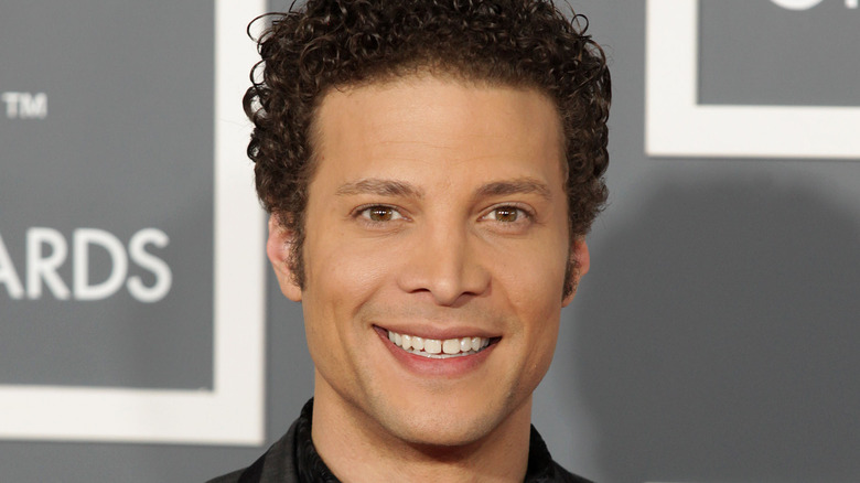 .Justin Guarini wearing dark colored clothes