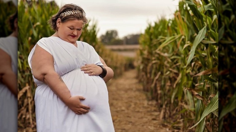 Amy Slaton-Halterman posing during maternity shoot for first pregnancy