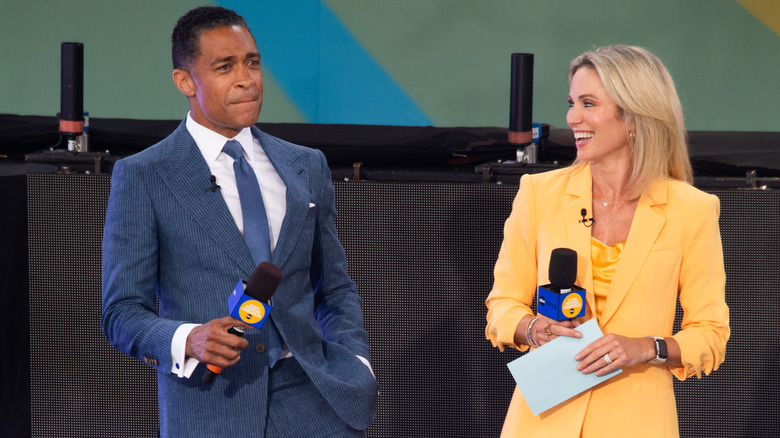 Amy Robach and TJ Holmes laugh