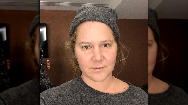 Amy Schumer slightly smiling