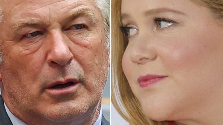 Alec Baldwin looking angry Amy Schumer looking left smiling