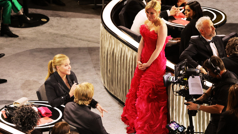 Co-host Amy Schumer, Jesse Plemons, and Kirsten Dunst are seen during the 94th Annual Academy Awards