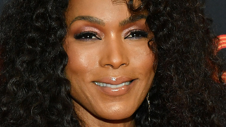 Angela Bassett wearing a pink shirt