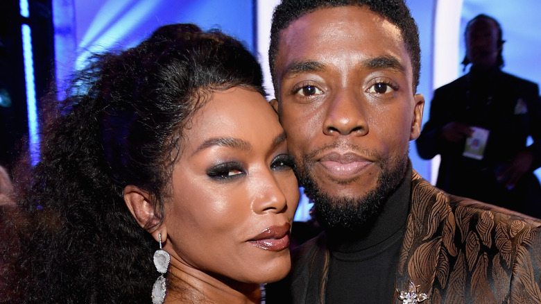 Angela Bassett posing with Chadwick Boseman