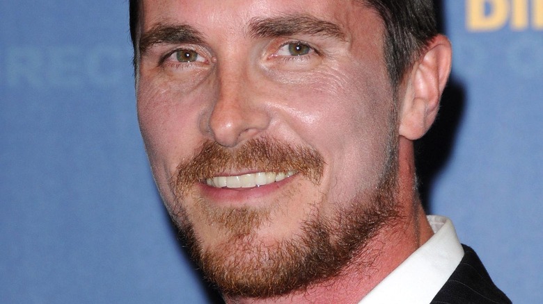 Christian Bale with an unbuttoned shirt