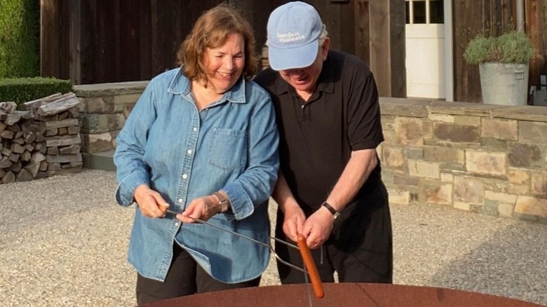 Ina Garten cooking hot dogs with Jeffrey Garten