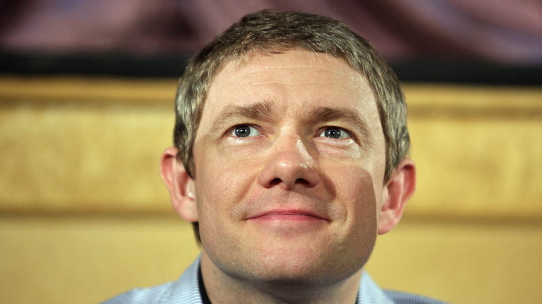 Martin Freeman smiling, looking up