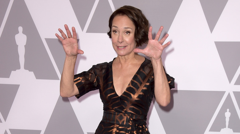 Laurie Metcalf posing with hands up