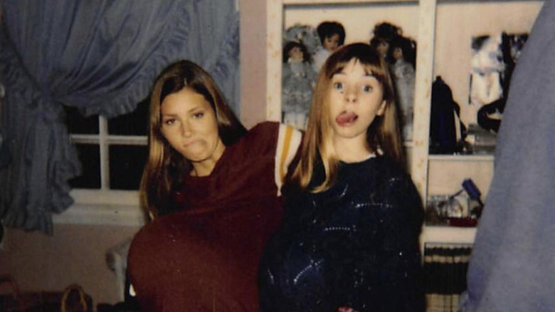 Beverly Mitchell and Jessica Biel posing