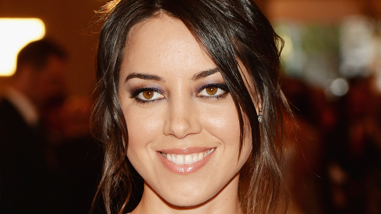 Aubrey Plaza smiles