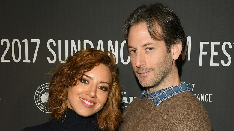 Aubrey Plaza stands with Jeff Baena