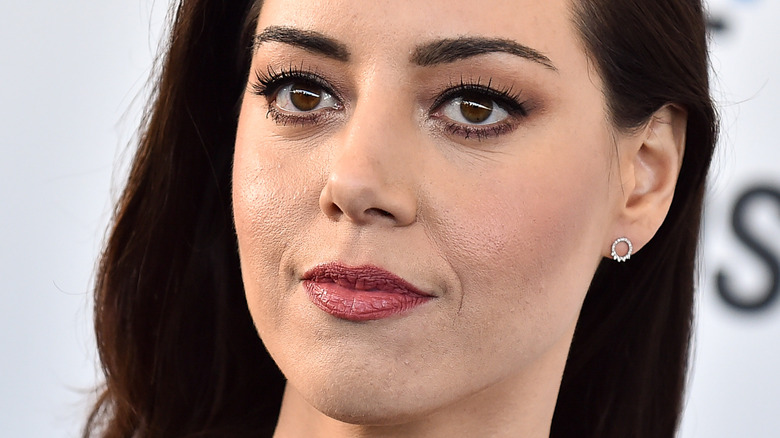 Aubrey Plaza poses at an event