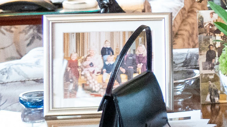 A framed photo of Queen Elizabeth with her great-grandchildren