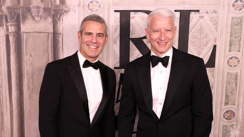 Andy Cohen and Anderson Cooper posing