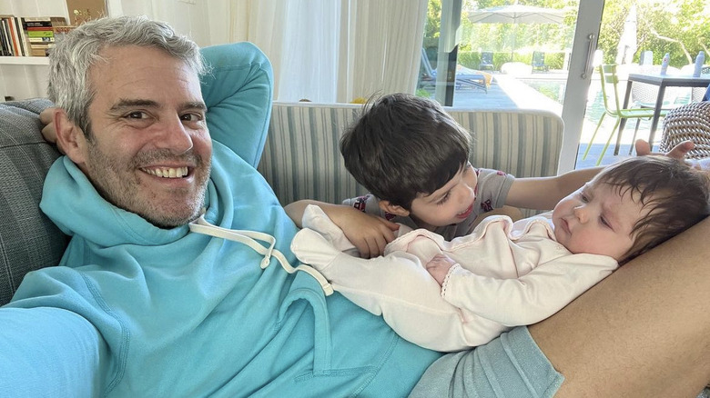 Andy Cohen posing with son and daughter