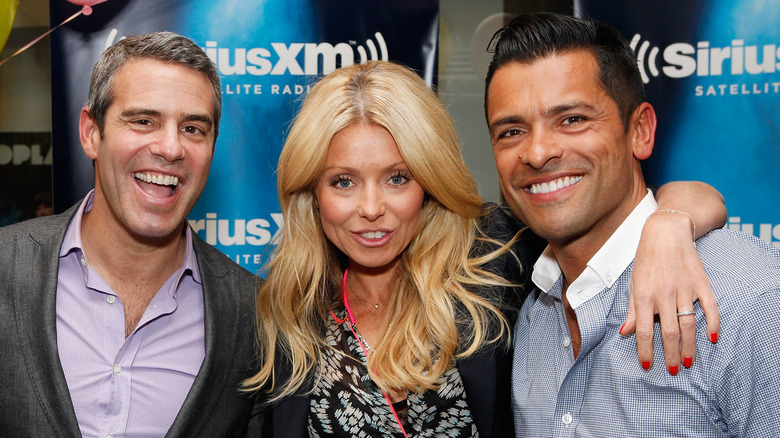 Andy Cohen poses with Kelly Ripa and Mark Consuelos 