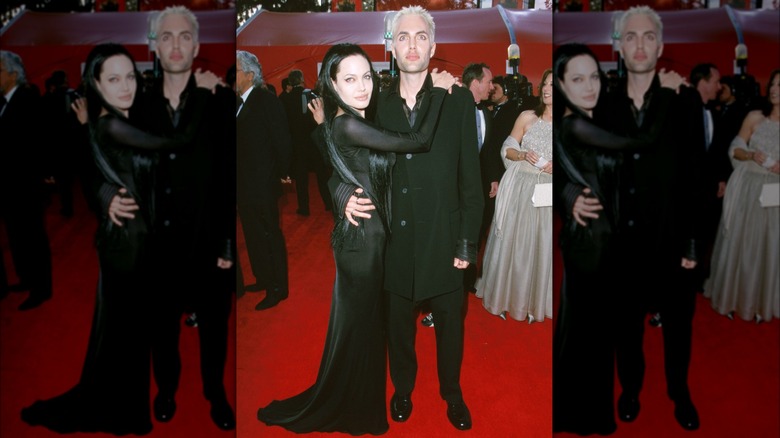 Angelina Jolie and James Haven hugging in black goth outfits