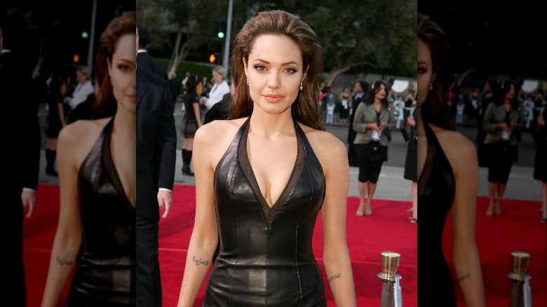 Angelina Jolie posing in leather dress