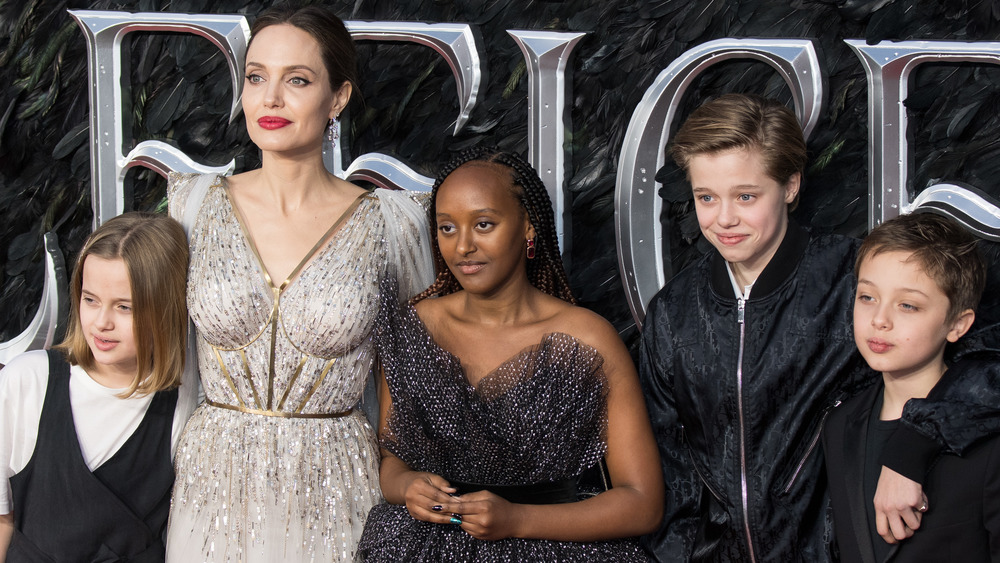 Angelina Jolie on a red carpet with her children