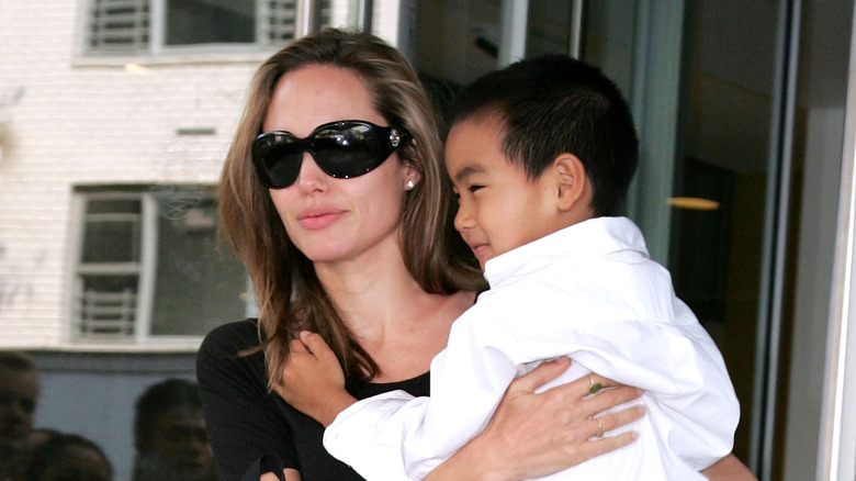 Angelina Jolie carrying young Maddox Jolie-Pitt