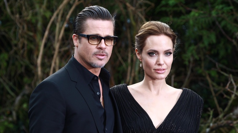 Angelina Jolie and Brad Pitt dressed in black