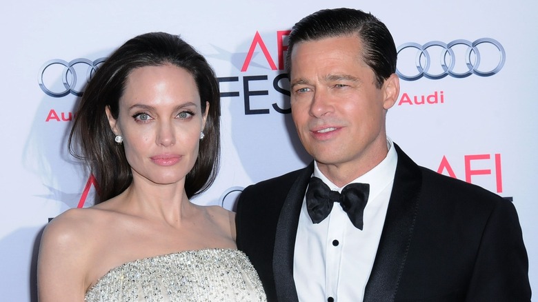 Angelina Jolie and Brad Pitt pose at an event