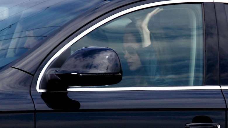 Angelina Jolie drives a car on the set of "Wanted"