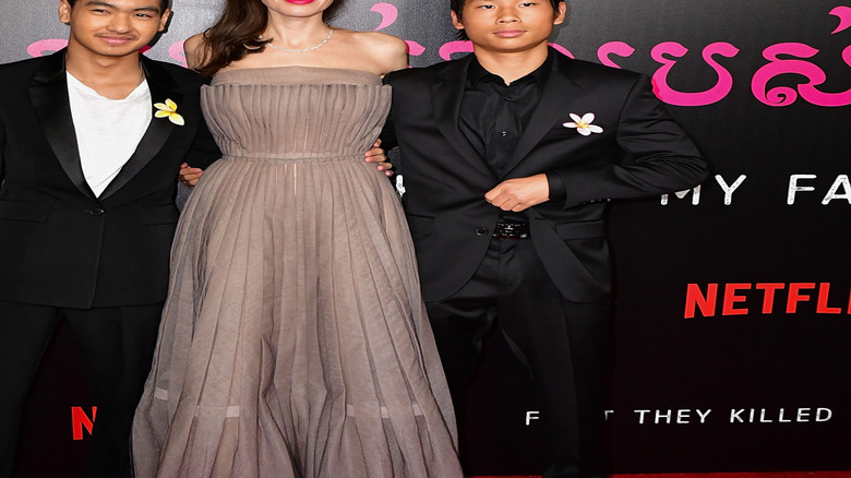 Pax, Maddox, and Angelina Jolie pose together at the 'First They Killed My Father' premiere