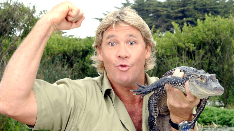 Steve Irwin posing with a croc