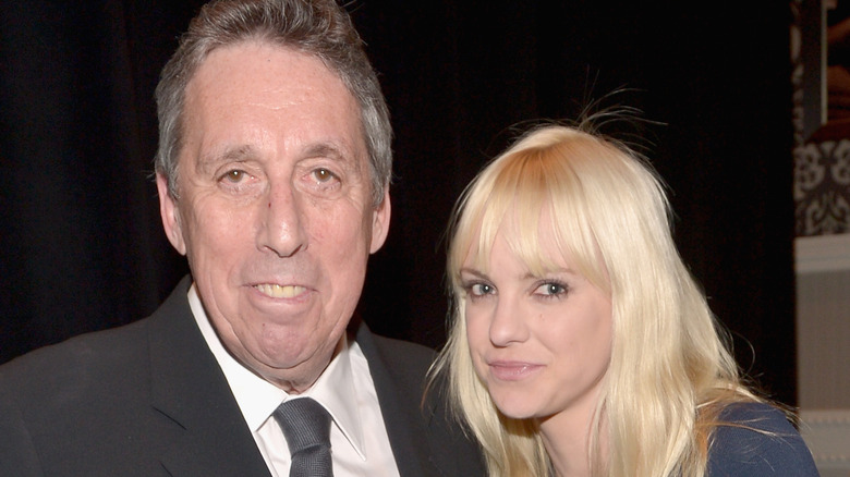 Ivan Reitman and Anna Faris attending an award show 