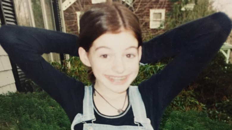 Young Anne Hathaway smiling