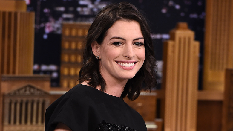 Anne Hathaway smiling on late night show