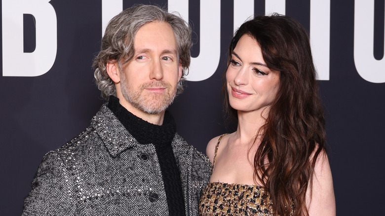 Anne Hathaway smiling at husband Adam Schulman