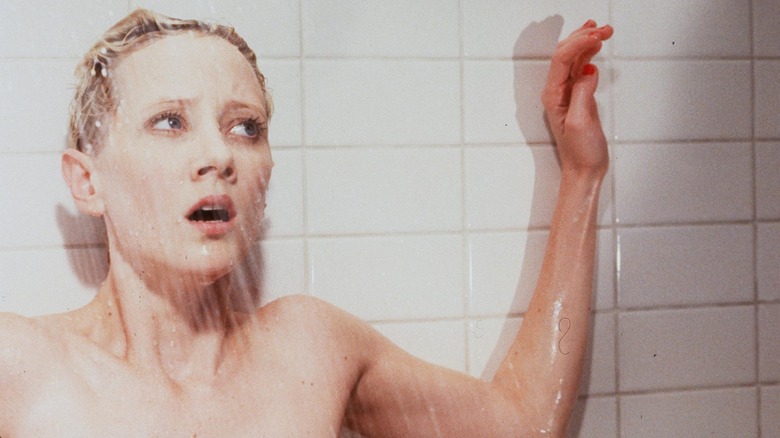 Anne Heche in a shower filming a scene