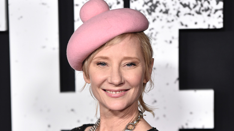 Anne Heche wearing pink hat